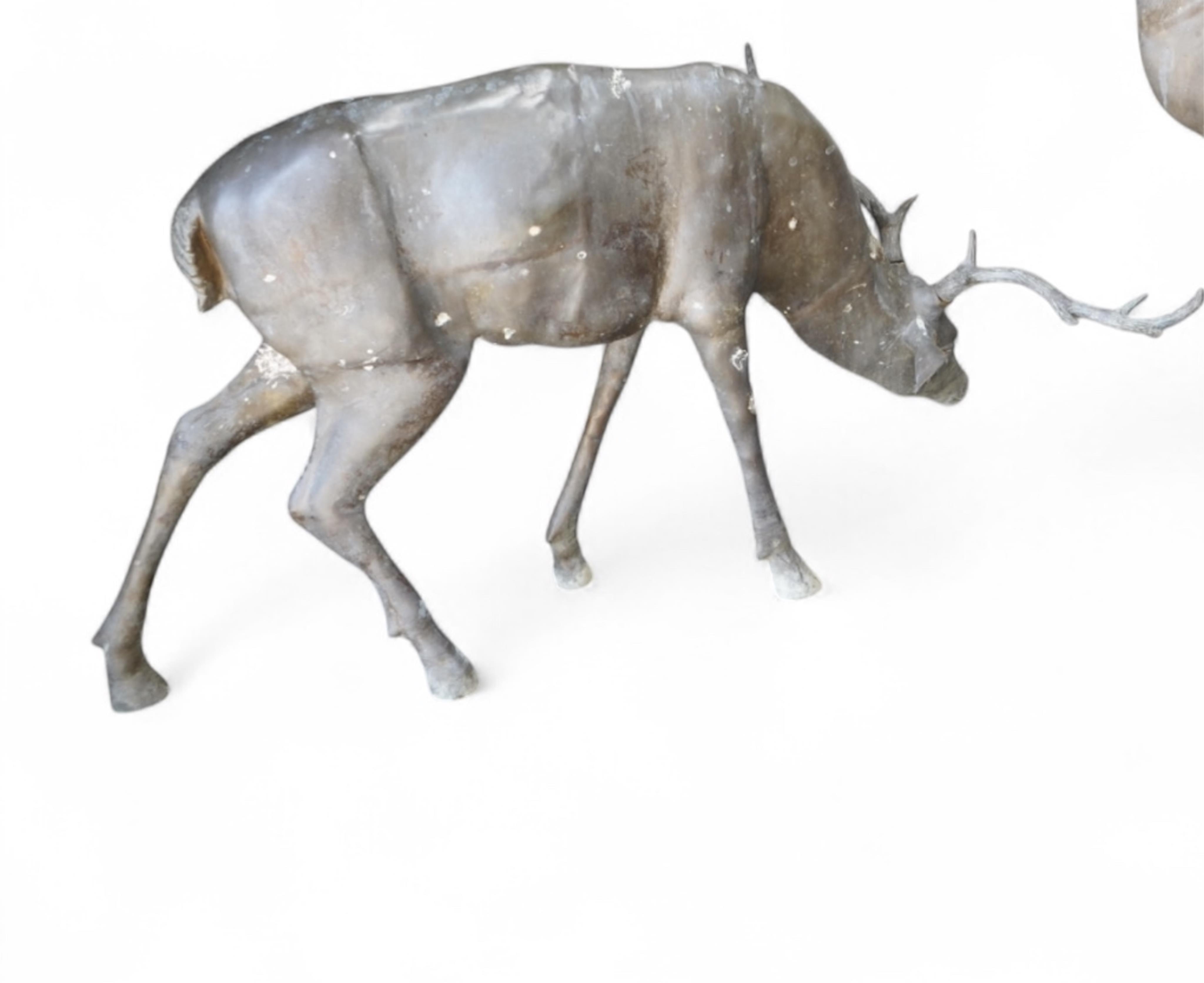 A Ryder life size cast bronze grazing stag garden sculpture length 140cm, height 78cm